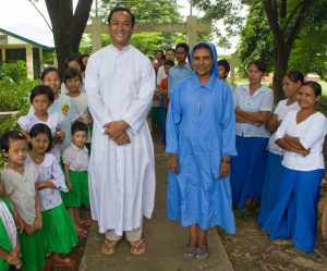Fr John Paul with members of his parish