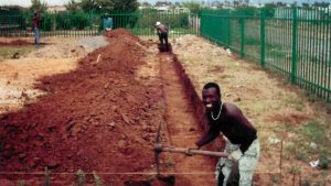 Digging foundations for St Francis Church, France Township