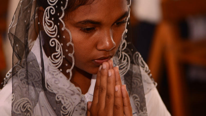 Sri Lankan woman praying