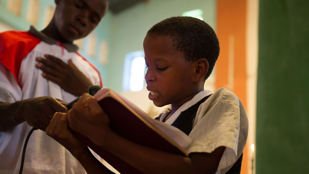 Young person reading scripture