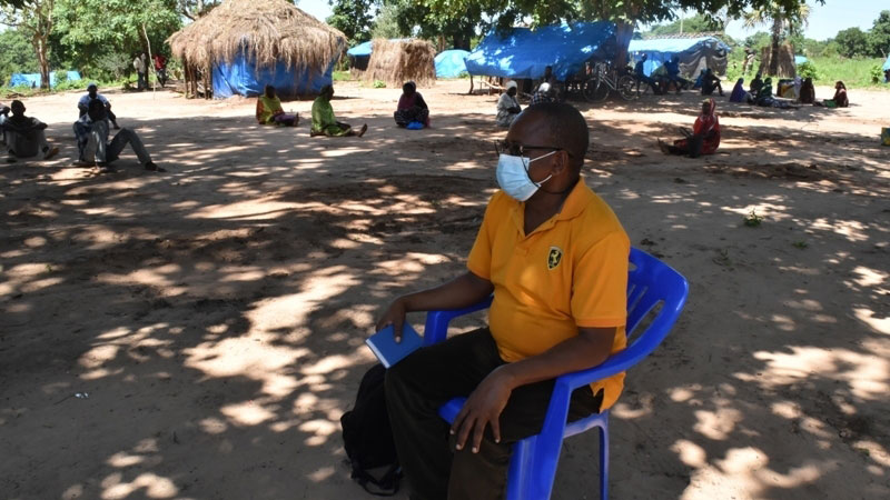 A catechist teaches in a time of social distancing.