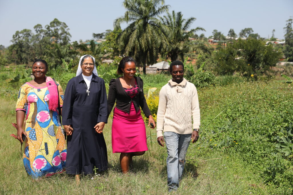 Sister walking with local community, Cameroon